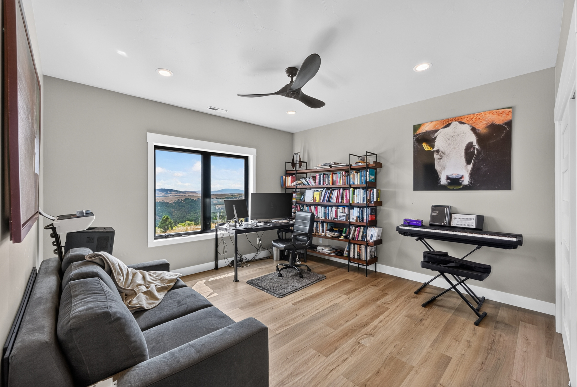 A home office at 2111 Vantage Circle with a desk facing the valley view