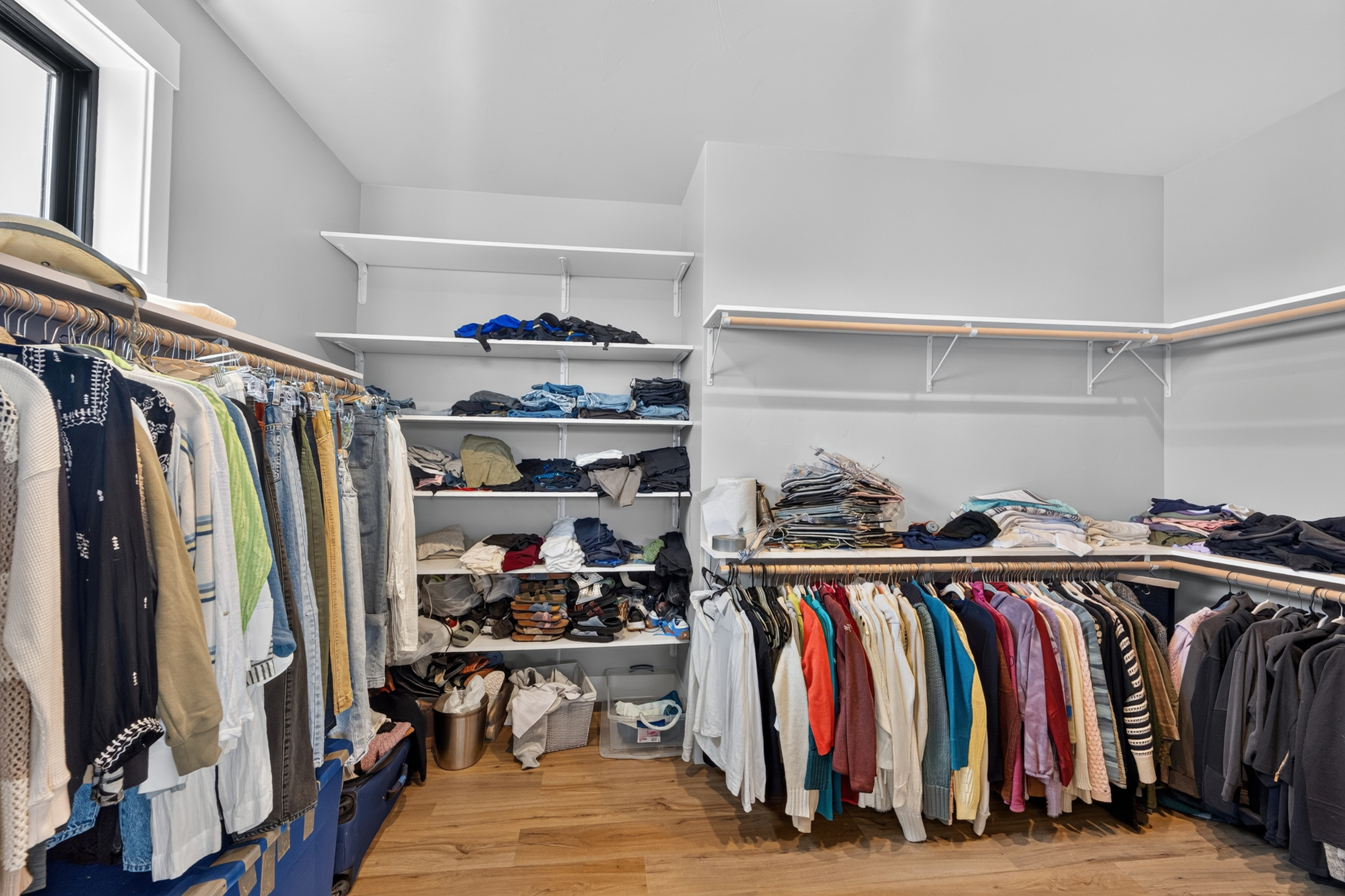 A walk-in closet at 2111 Vantage Circle lined with white shelving